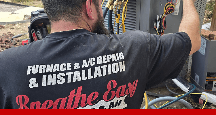 Technician working on HVAC unit