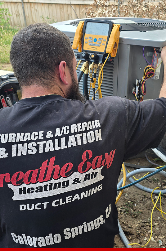 Technician working on an AC unit